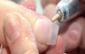 Do nail drills produce large dust particles?